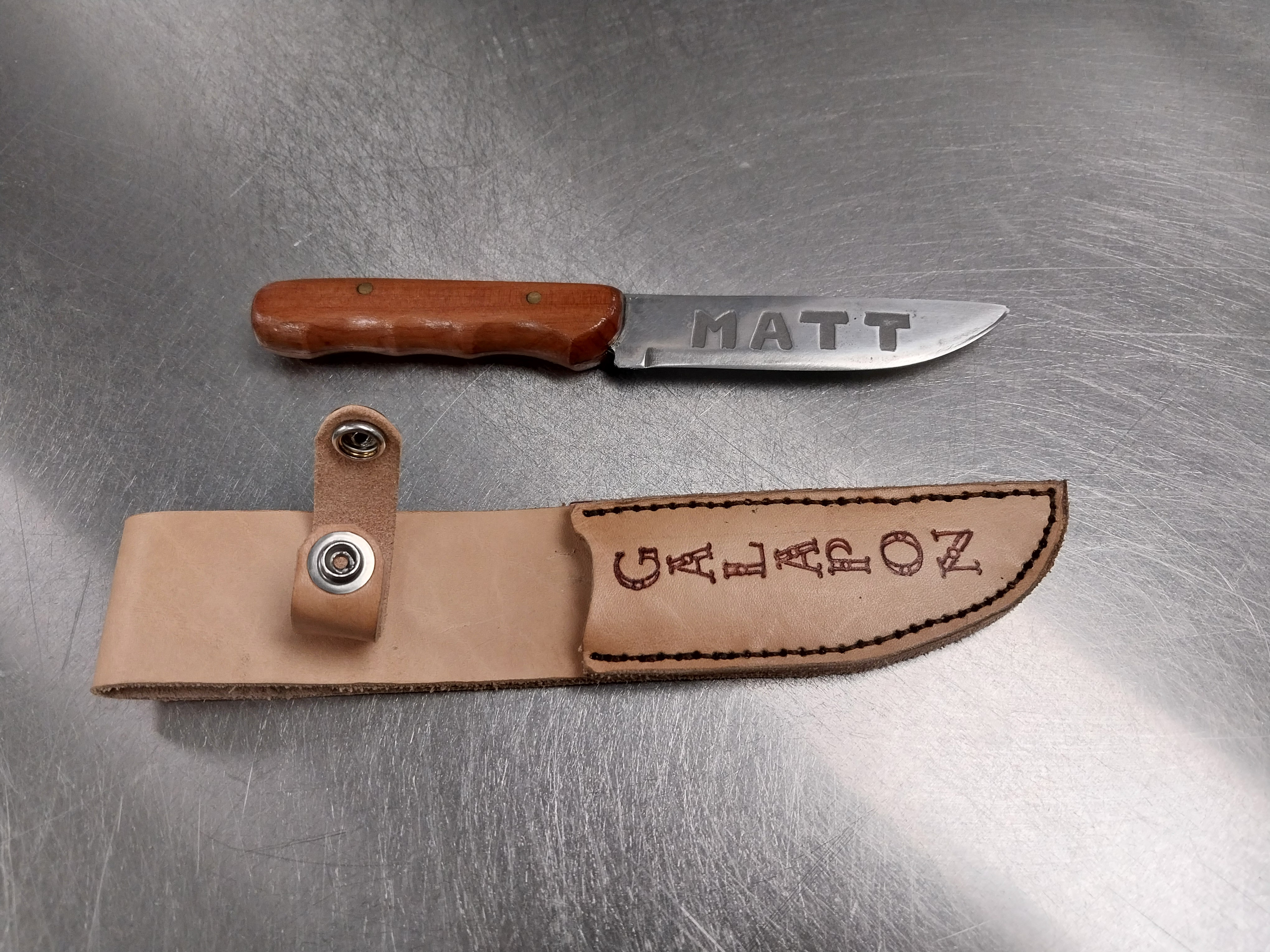 Ray brought me a block of wood with sentimental value so I hade a handle then made a blade to fit it. blade is AEBL stainless steel chemically ingraved with names